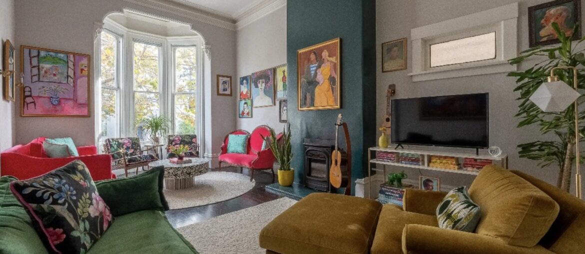 Tall living room with a bay window in a one-bedroom 1000-square-foot apartment, Mission District, San Francisco, California [2190x1470]