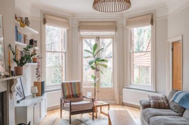 Living room with French doors opening up to the garden in a Victorian villa with a modern kitchen and dining extension, Willesden Green, northwest London, UK [711x1067]