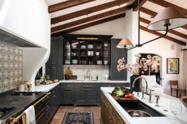 Wood-beamed vaulted ceiling kitchen with terracotta tile floors in a Spanish-style house, Carmel, Monterey County, California [1440x960]