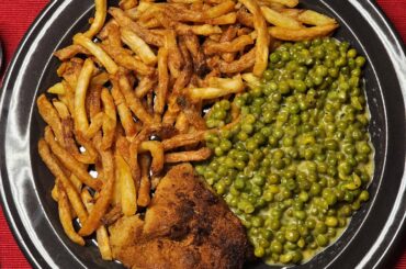 Homemade breaded schnitzel and fries, with creamy caramelised peas (and some of us can't do without tomato sauce for their fries ;)