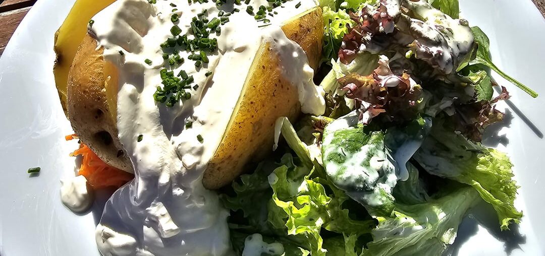 Jacket potato with plenty of dip, along a mixed salad; and spaetzle with a side salad; Reichenau, Lake Constance