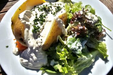 Jacket potato with plenty of dip, along a mixed salad; and spaetzle with a side salad; Reichenau, Lake Constance