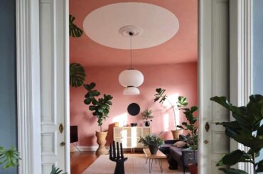Pink living room in an apartment full of houseplants, Cuxhaven, Lower Saxony, Germany [1440x1800]