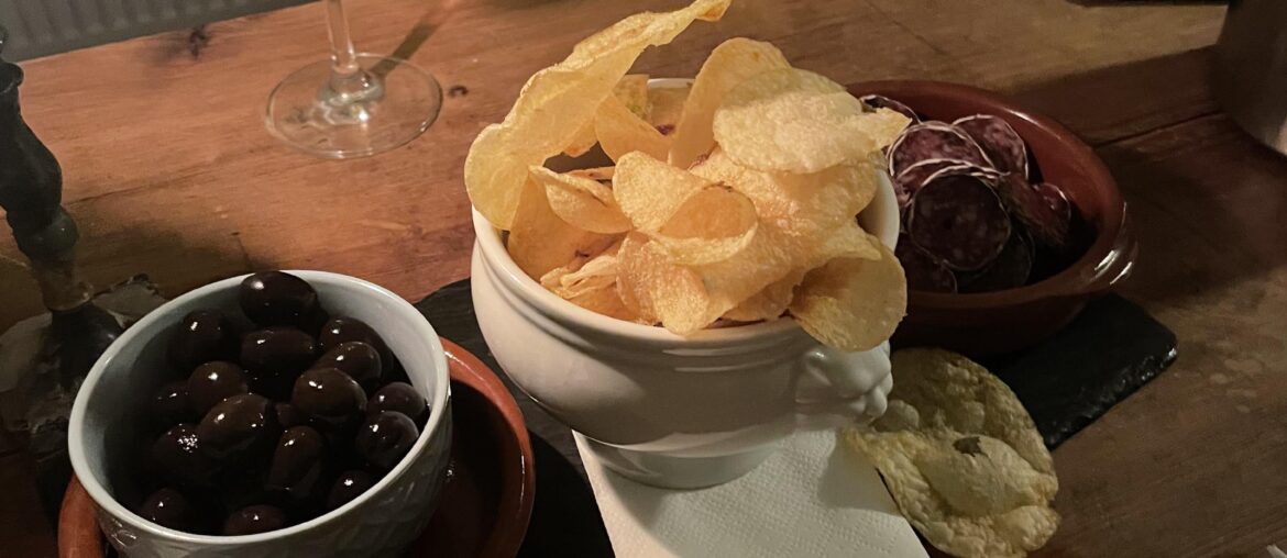 Wine bar tapas - Olives, chips, and saucisson