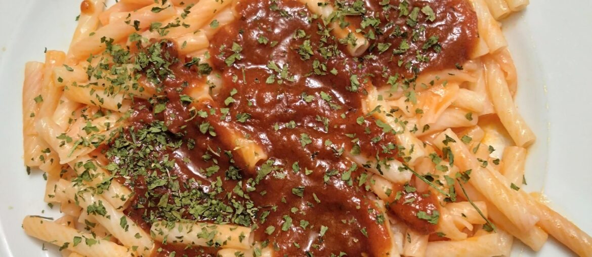 Pasta with tomato-black garlic sauce