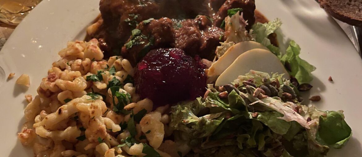 Gulasch, Spätzle, and Salad