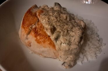 Pan-Fried Chicken Breast with a Tarragon Mushroom Cream Sauce on Rice