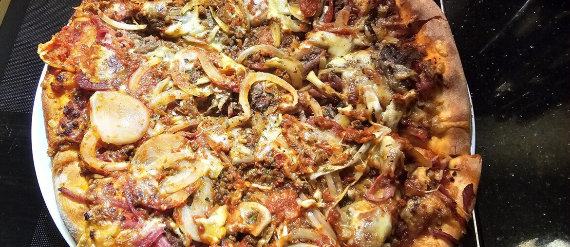 Home made pizza with a bit too much of everything!