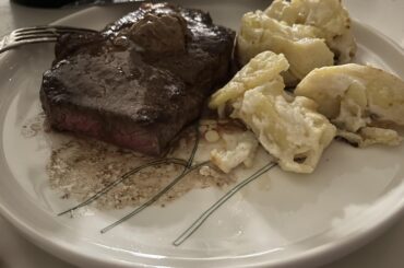 Strip steak, pommes au gratin and black garlic butter.