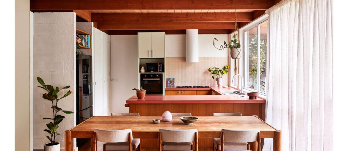 Kitchen with Kit Kat tile backsplash and original pink benchtops in a renovated 1980s house, Mount Martha, Melbourne, Victoria, Australia [6250x3515]