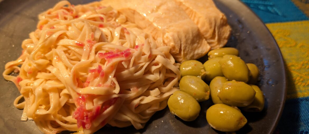 Homemade Pasta with lemon white wine butter sauce, salmon and olives.