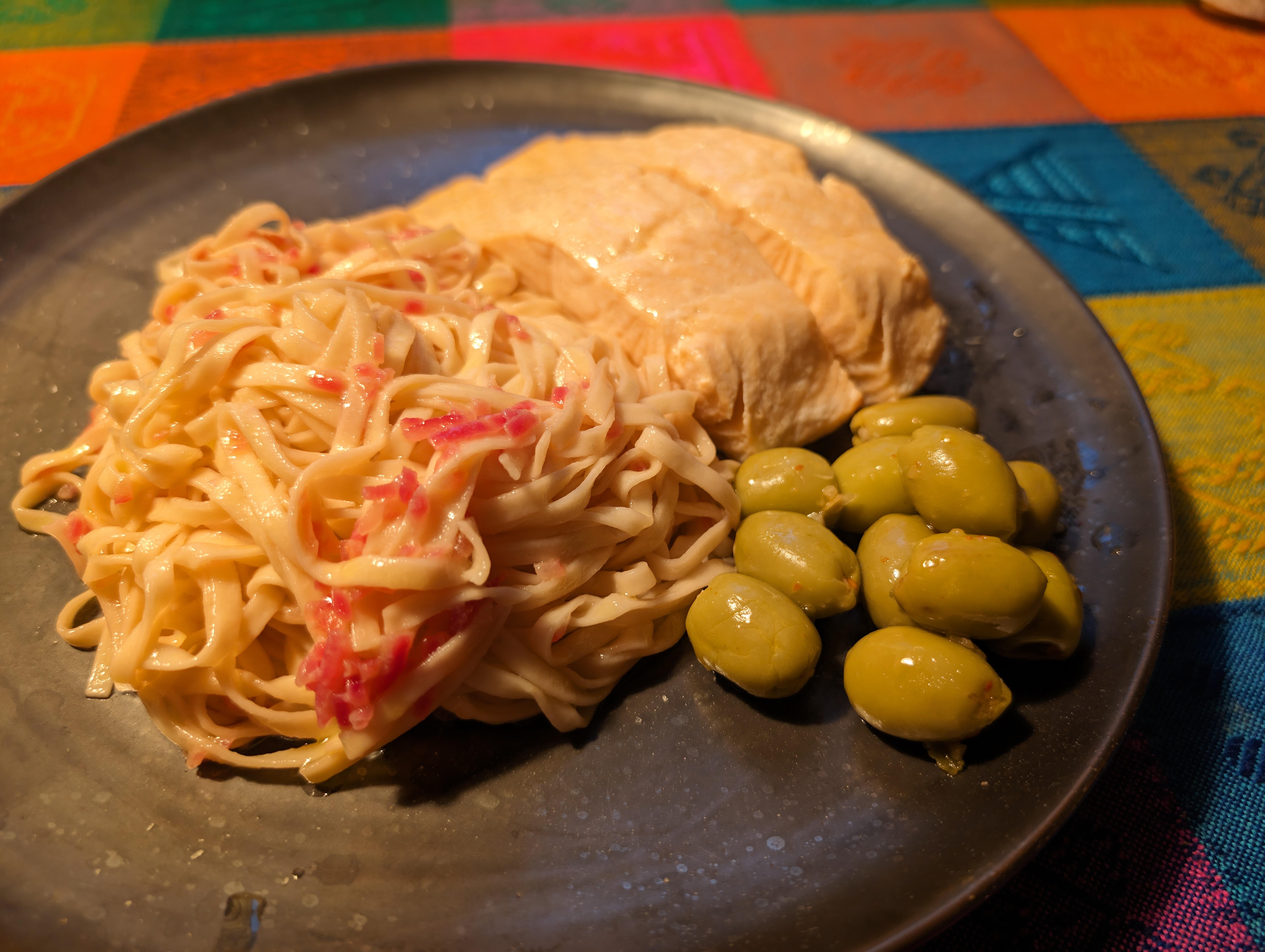 Homemade Pasta with lemon white wine butter sauce, salmon and olives.