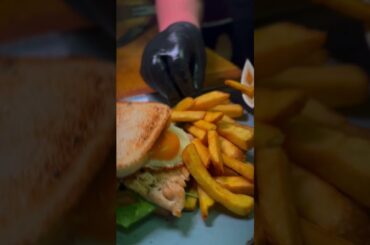 Club sandwich. Grilled chicken, poached egg, bacon, mayo, french fries.