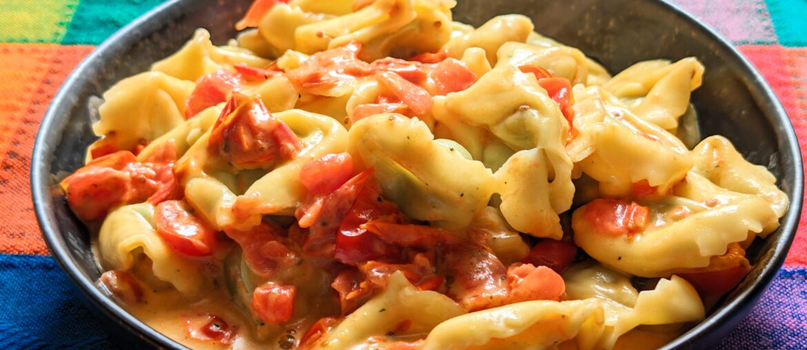 Ricotta spinach tortellini with tomato cream sauce.