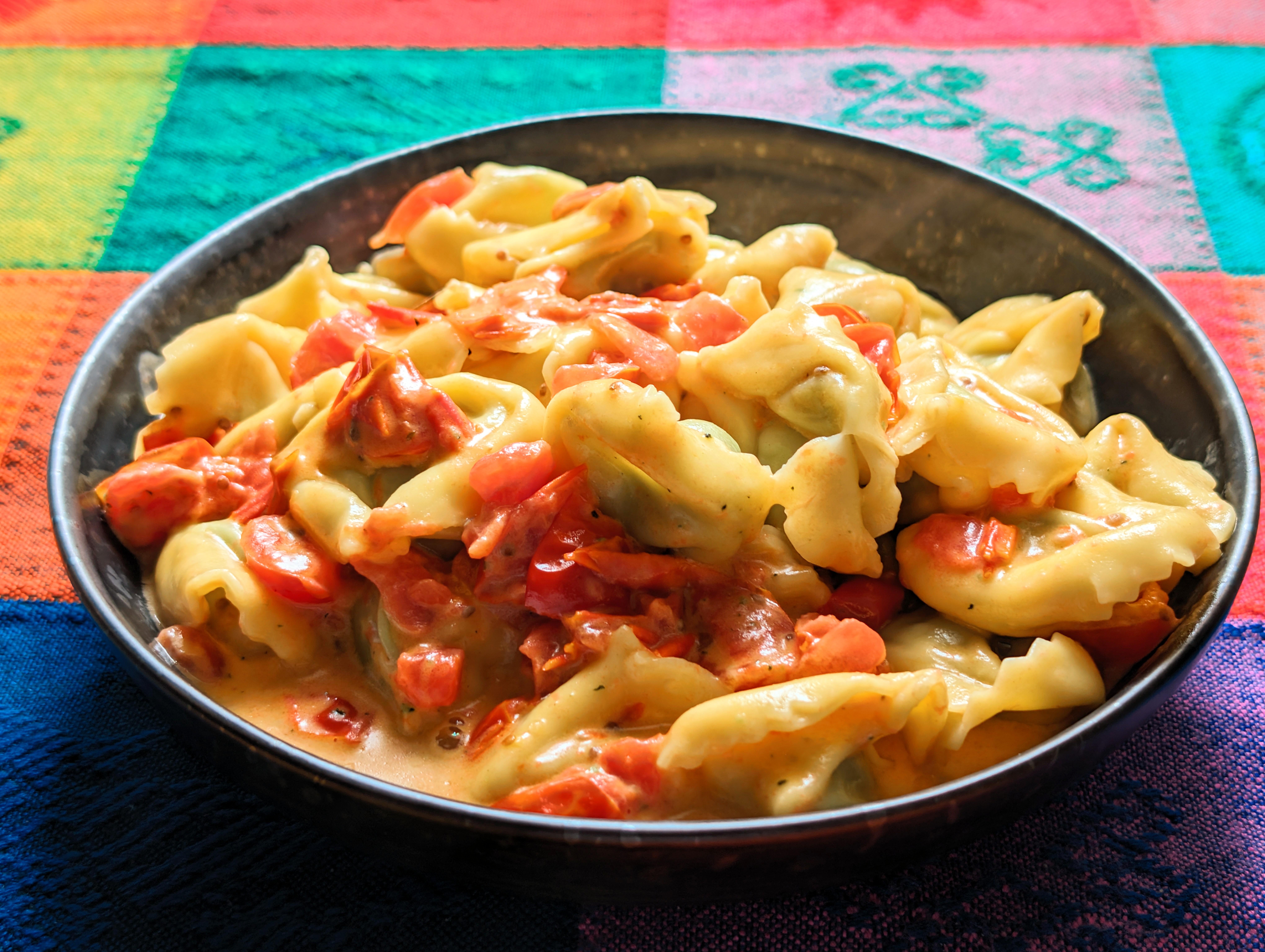 Ricotta spinach tortellini with tomato cream sauce.