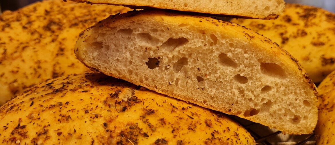 Ready for BBQ: Mediterranean bread with olive oil plus herbs and parmesan topping
