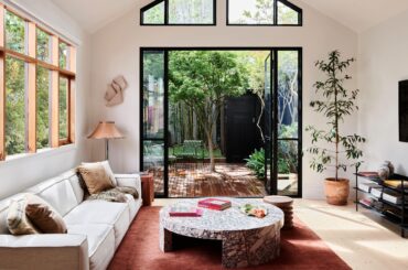 Living space with steel framed doors opening up to the garden in a renovated Victorian terrace, Northcote, Melbourne, Australia [6250x3515]