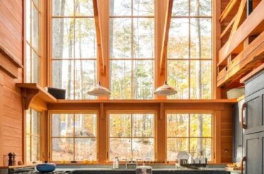 Tall-ceiling kitchen in a remote holiday retreat using a lot of timber on a private wooded island, Oxford County, Maine [842x1263]