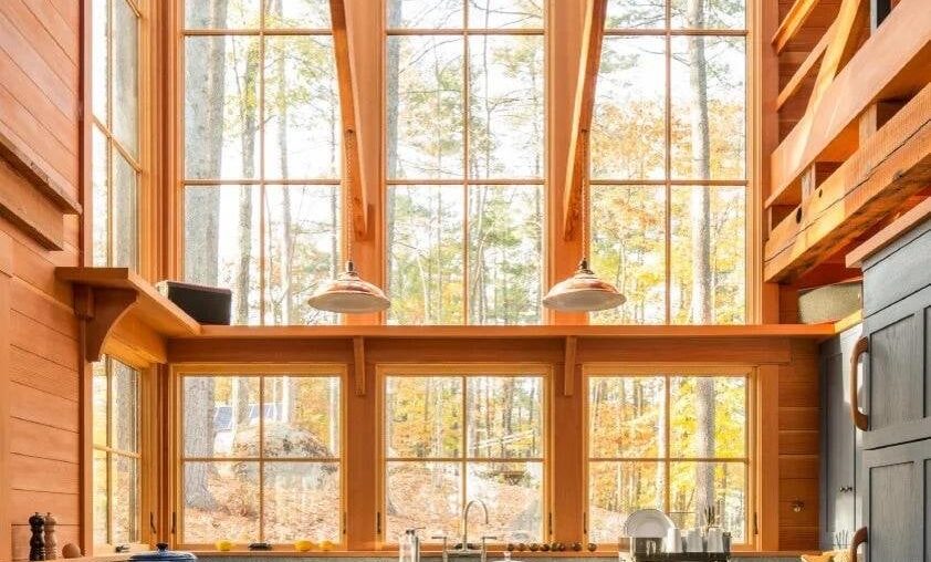 Tall-ceiling kitchen in a remote holiday retreat using a lot of timber on a private wooded island, Oxford County, Maine [842x1263]