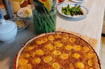 The tart with quail eggs my mom baked for our Easter Breakfast, plus my sister's pistachios cheesecake.