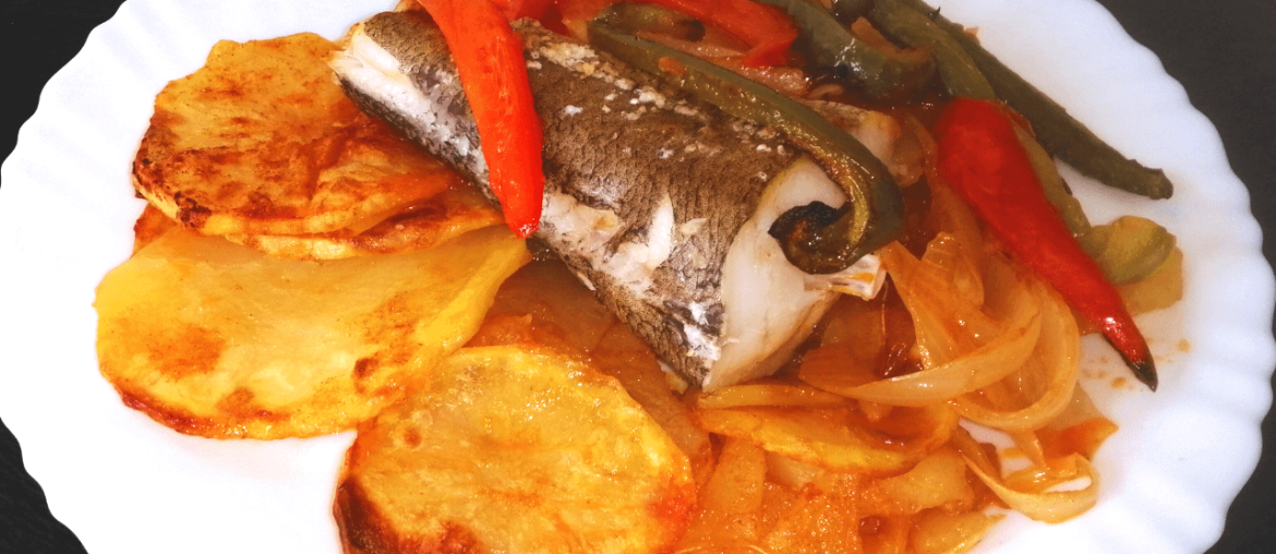 Sliced Potatoes, Fish and Vegetables Cooked In The Oven