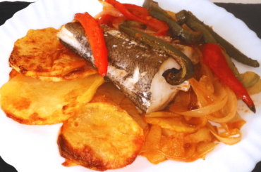 Sliced Potatoes, Fish and Vegetables Cooked In The Oven