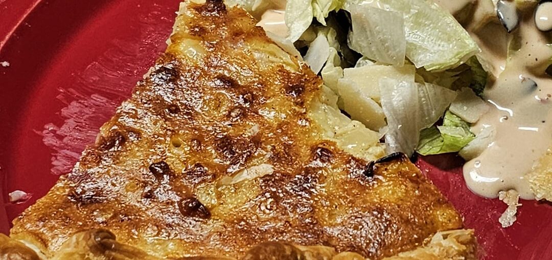 Cheese and onion Wähe with a side salad