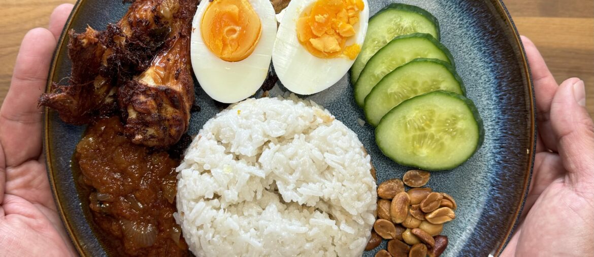 Nasi Lemak, a Malaysian local dish. Coconut rice infused with Pandan, homemade sambal, spiced chicken, boiled eggs, fried anchovies, cucumber and toasted nuts.