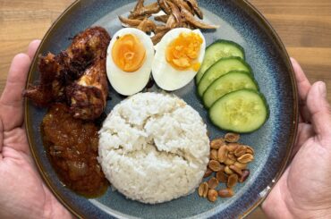 Nasi Lemak, a Malaysian local dish. Coconut rice infused with Pandan, homemade sambal, spiced chicken, boiled eggs, fried anchovies, cucumber and toasted nuts.