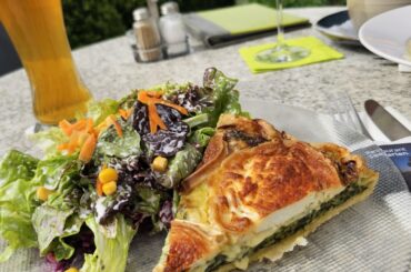 Homemade spinach quiche with goat's cheese and mixed salad, served in Allensbach (Germany)