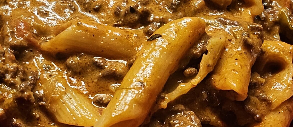 Penne with slow-cooked ragù (hashed beef with veggies)