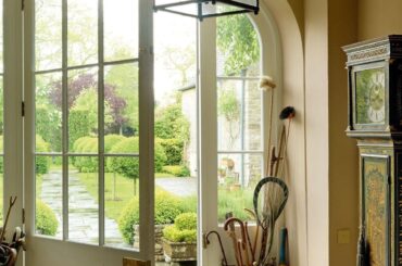 Entrance hall of a former stable converted into a country house, Oxfordshire, South East England [1280x1920]