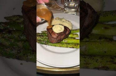 Juicy filet with a dollop of butter and creamy peppercorn sauce