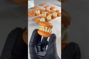 French meringue macarons with dry egg white. Vanilla and passion fruit filling