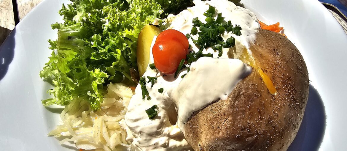 Hot jacket potato with sour cream and mixed salad