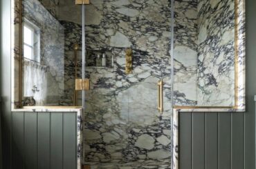 Marble-clad shower in a renovated farmhouse, Wiltshire, England [1440x1800]