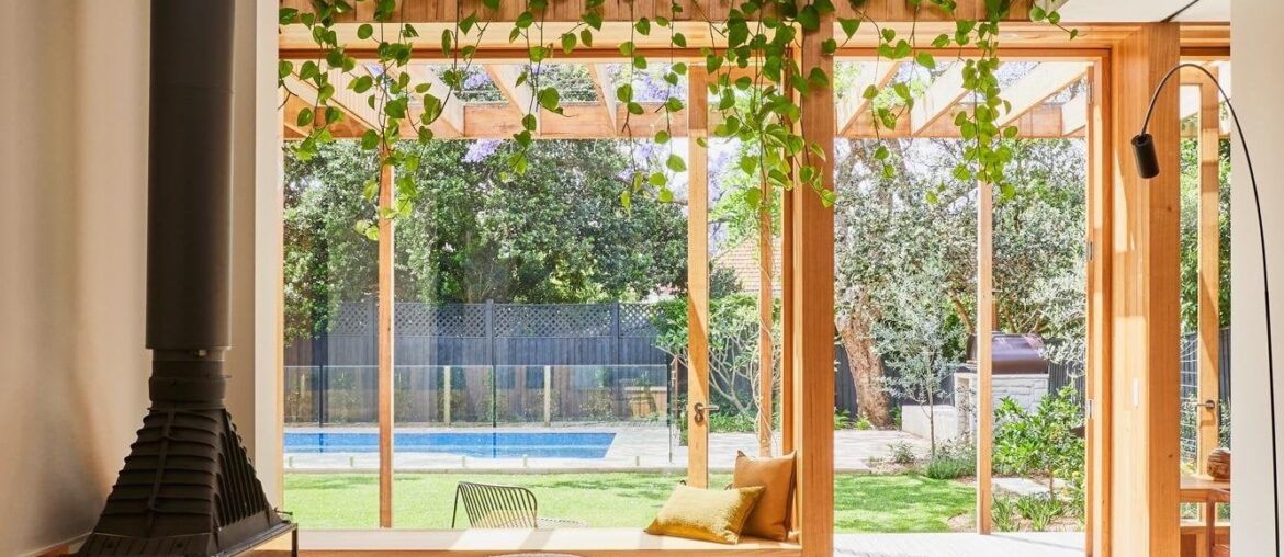 Double-height living space with garden views in a timber extension added to a Federation Queen Anne-style bungalow, Sydney, New South Wales, Australia [1334x2000]