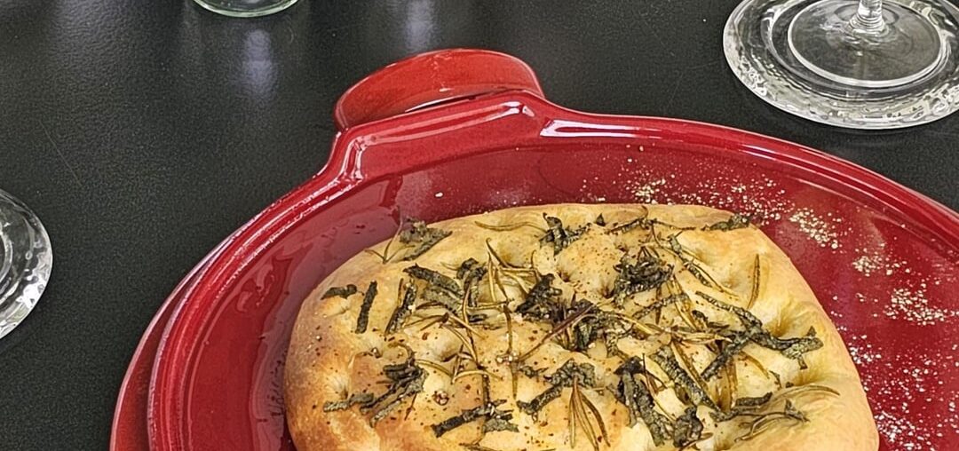 Focaccia made from leftover pizza dough (in addition to the obligatory rosemary, we also like to add a little sage)