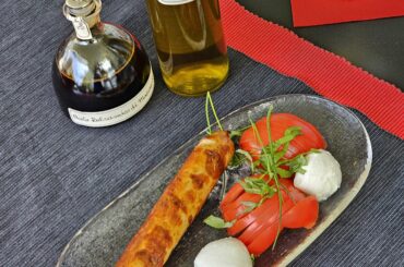 Rostbratwurst (grilled sausage), with what we affectionately call Tomazella (tomatoes with mozzarella di bufala)