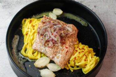 Trout & pearl onions cooked en papillote with beurre blanc & white wine served on a bed of pasta in a mustard & lemon sauce