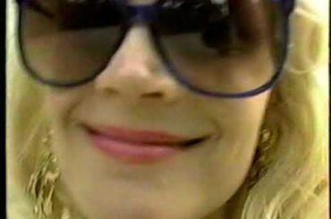 BOTTLE OF RED WINE LOAF OF FRENCH BREAD LAYING ON A BLANKET IN FRONT OF EIFFEL TOWER PARIS 1995