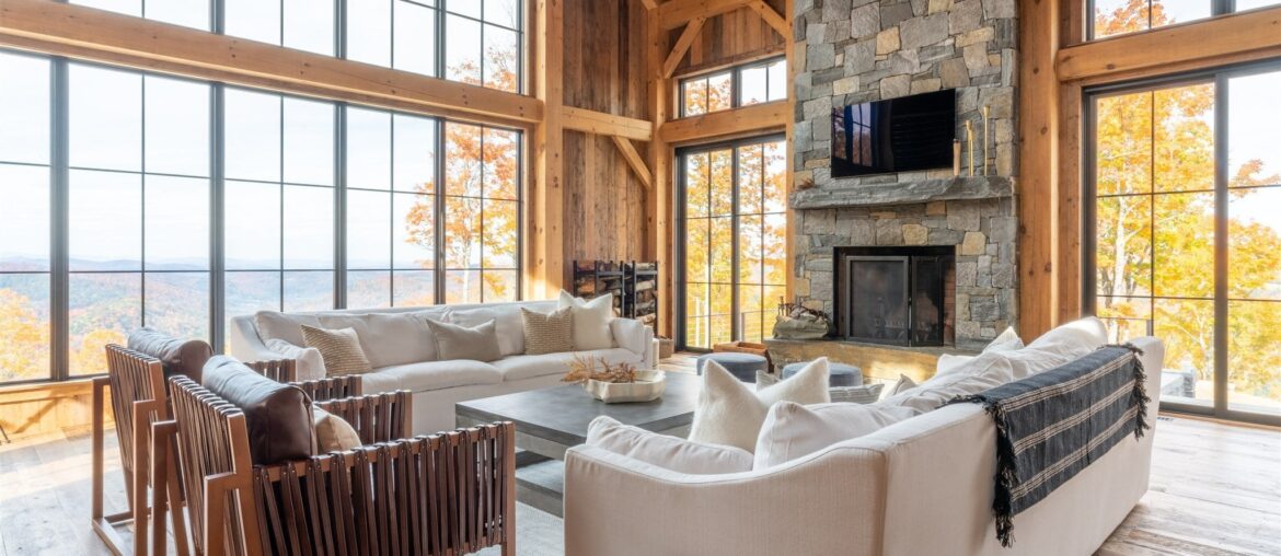 Mountain views from a spacious and rustic living room built with reclaimed wood sourced from dilapidated barns, Woodstock, Vermont [2048x1366]