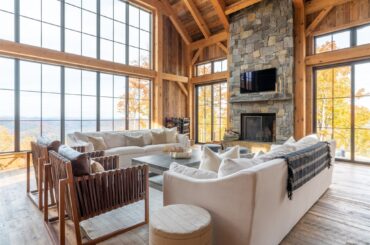 Mountain views from a spacious and rustic living room built with reclaimed wood sourced from dilapidated barns, Woodstock, Vermont [2048x1366]