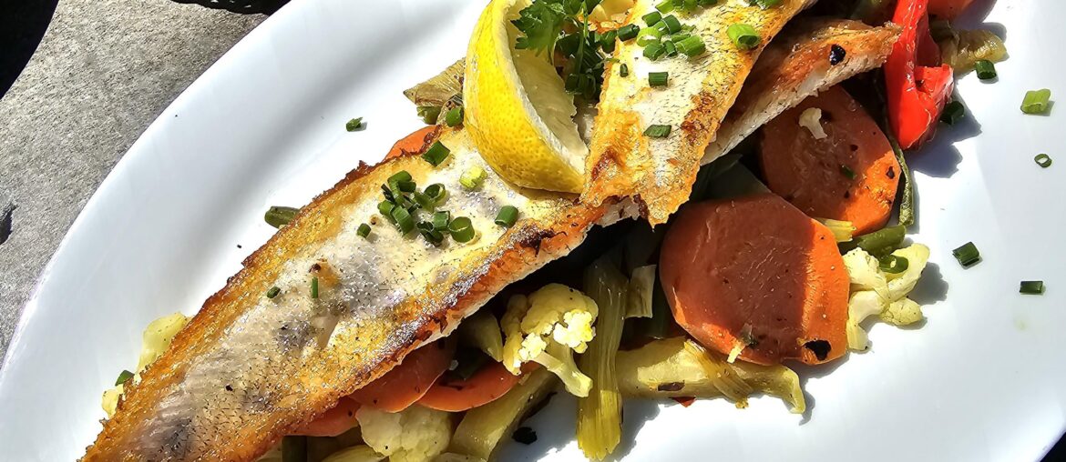 Grilled zander fillets on vegetables (carrots, cauliflower, courgettes, green beans and peppers), Lake Constance, Germany