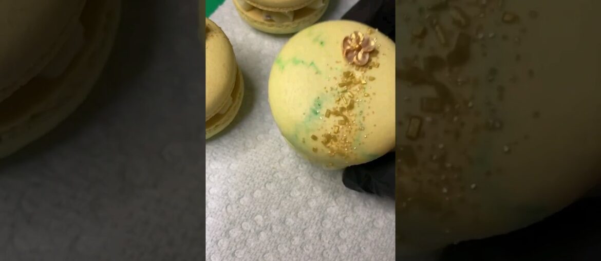 French meringue macaroons filled with gum mastic and vanilla bean ganache with caramel pistachios