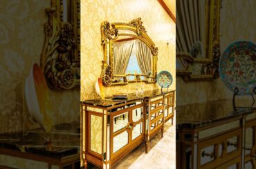 Elegant Dining Room Design: Solid Wood Table, French Chairs, Crystal Chandelier & 18th Century Curio