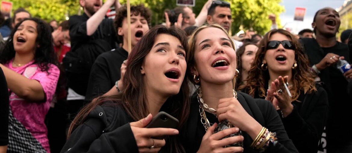 Paris crowd cheers as French election results announced Paris crowd cheers as French election results announced