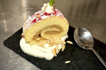 Banana Butter vanilla roulade with sweet whipped cream & toasted almonds