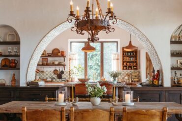 Archway lined with hand-glazed bricks to the kitchen in a California ranch house renovated with antiques from Mexico [1024x1536]