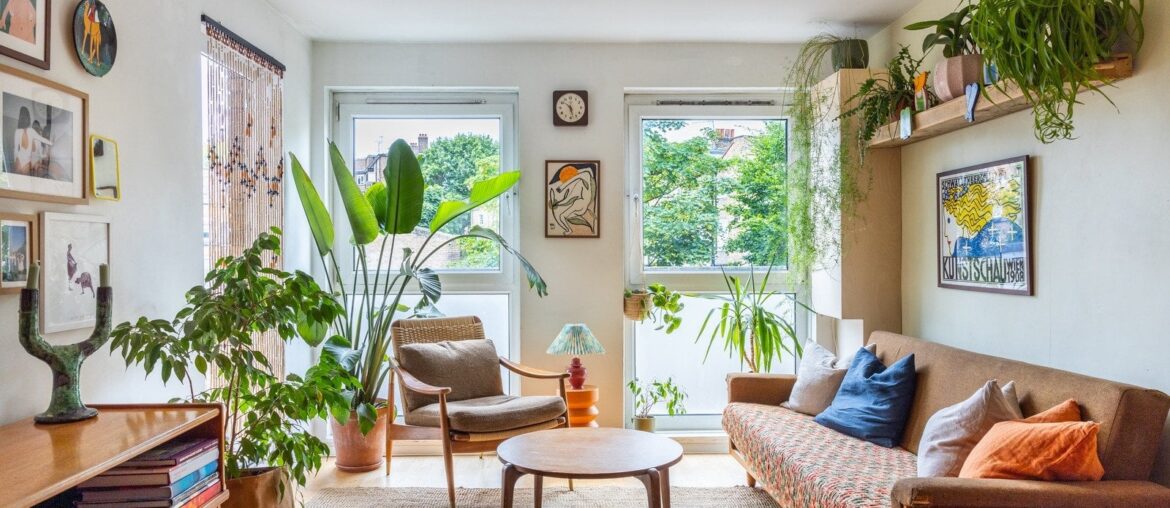 Living space full of houseplants in a two bedroom apartment, Islington, London, UK [1600x1067]